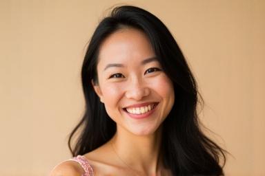 Professional headshot of Lisa Chen, a cheerful woman with dark hair and a bright smile.